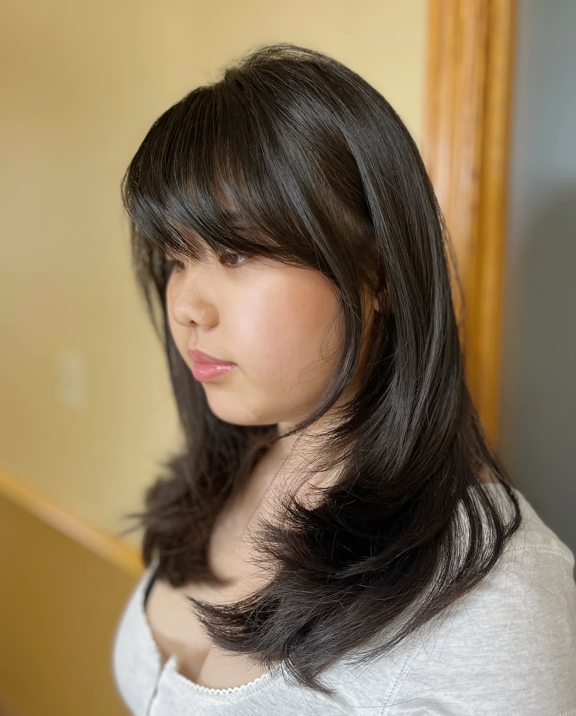 Soft Side Swept Bangs On Layered Espresso Hair