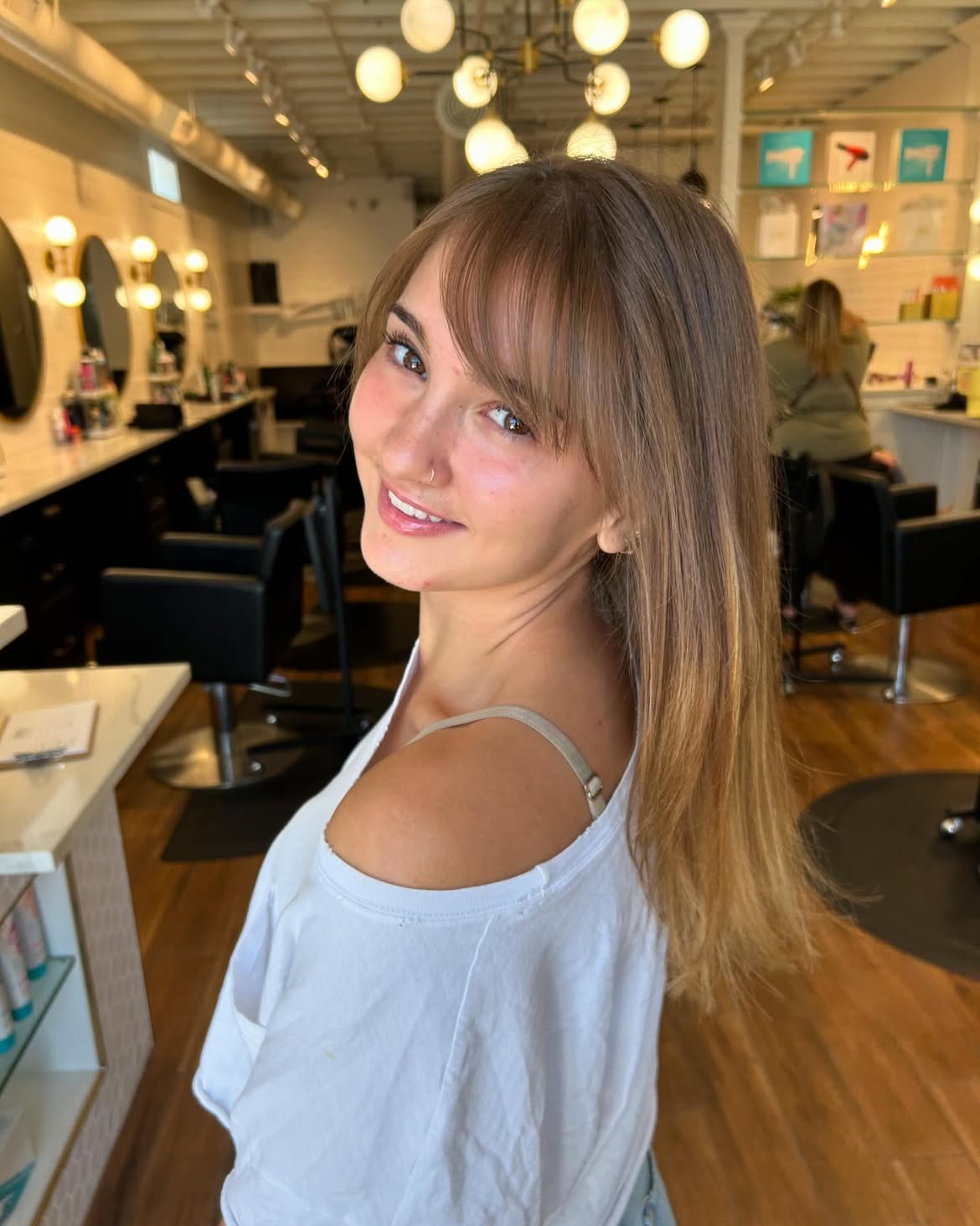 Soft Side Swept Bangs On Long Layered Brunette