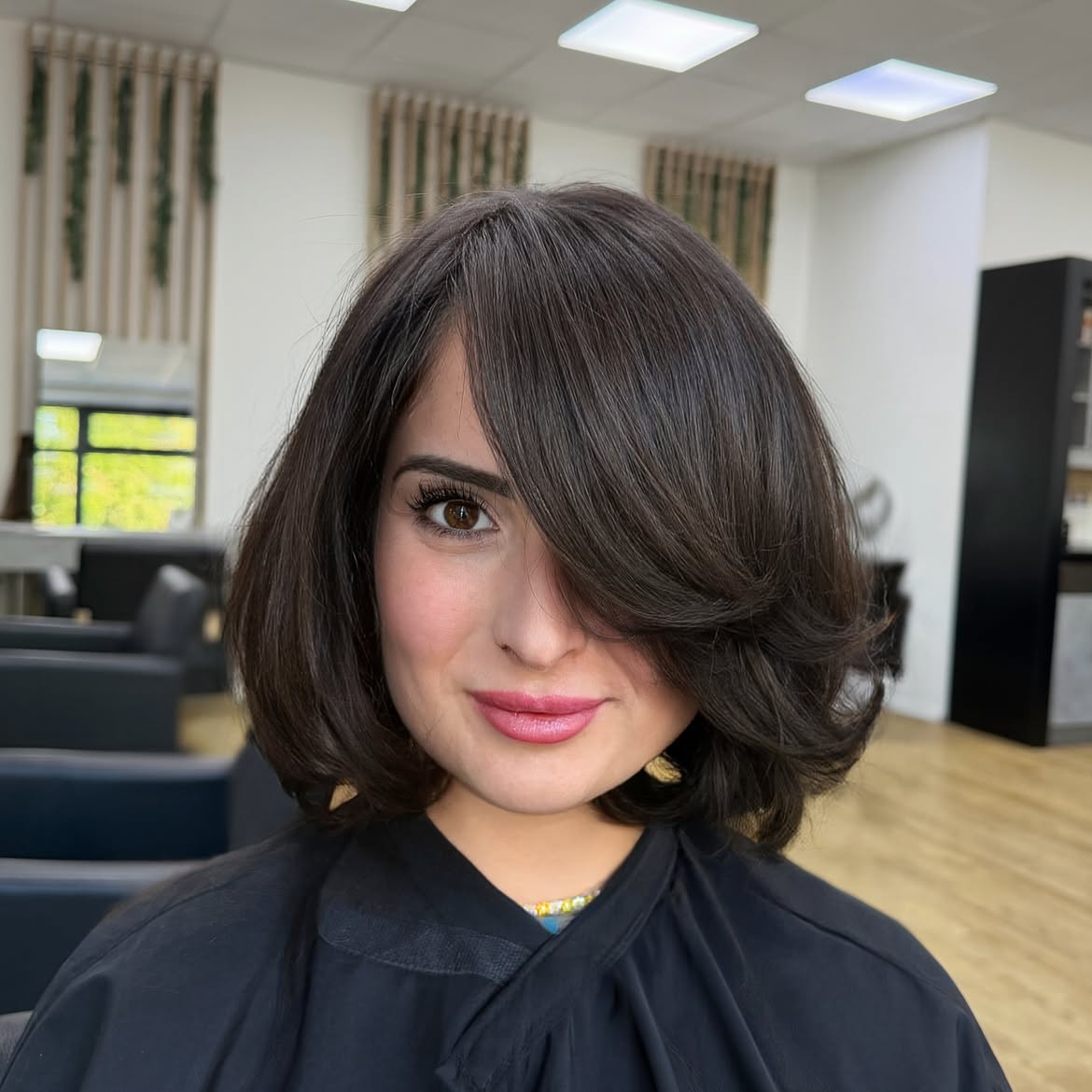 Soft Side Swept Bangs On Voluminous Brunette Bob