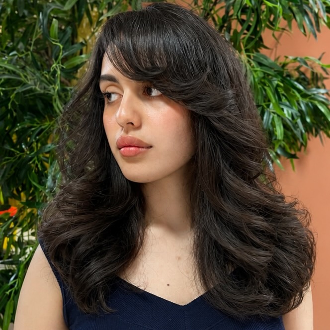 Soft Side Swept Bangs With Voluminous Layered Waves