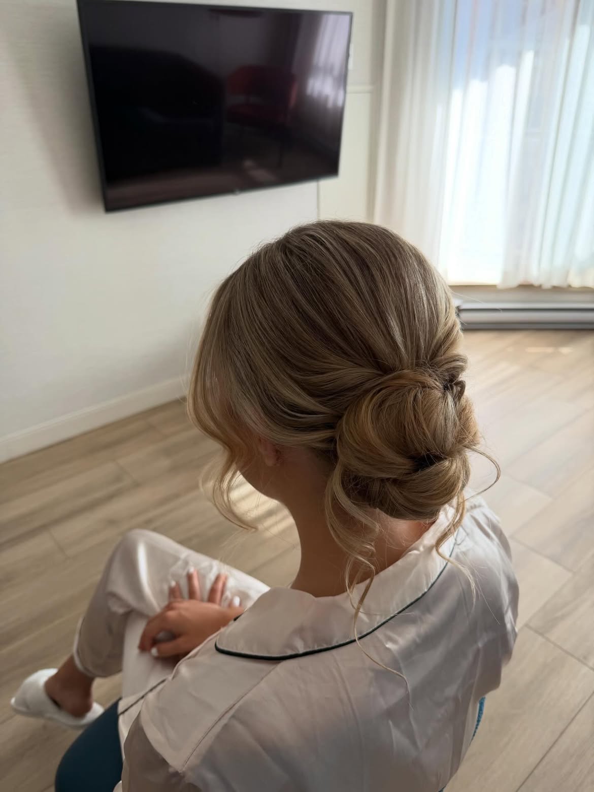 Soft Textured Low Bun With Face Framing Tendrils