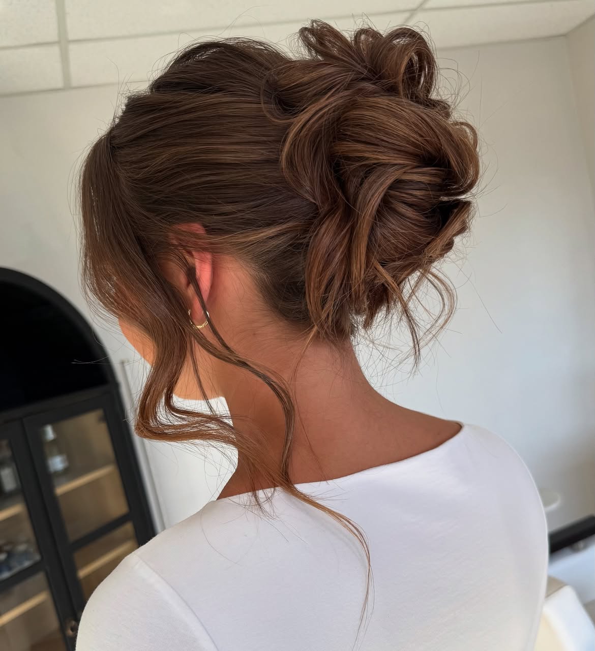 Soft Textured Messy Bun With Face-Framing Tendrils