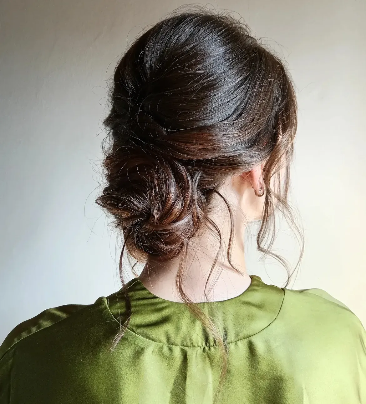Softly Tousled Low Messy Bun With Face Framing Tendrils
