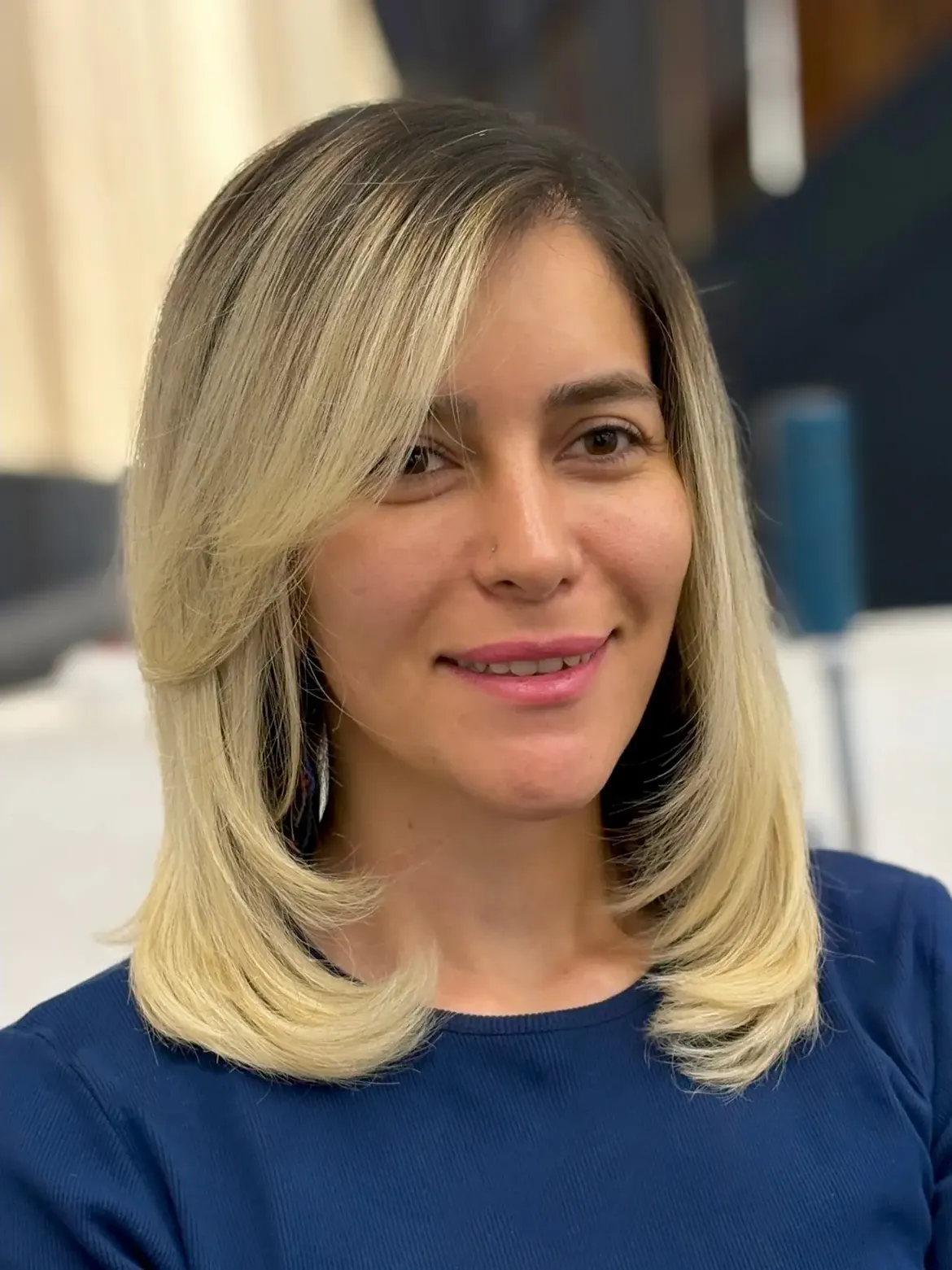 Sophisticated Side Swept Bangs On Blonde Layered Cut