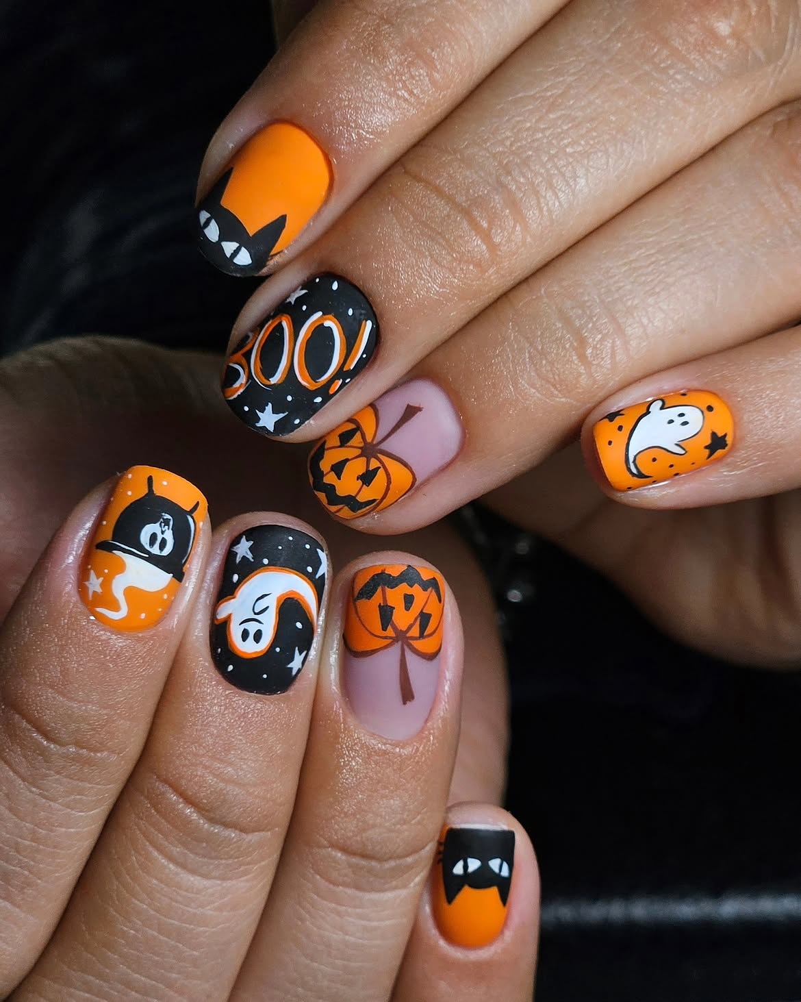 Spooky Halloween Nail Art with Ghosts and Pumpkins