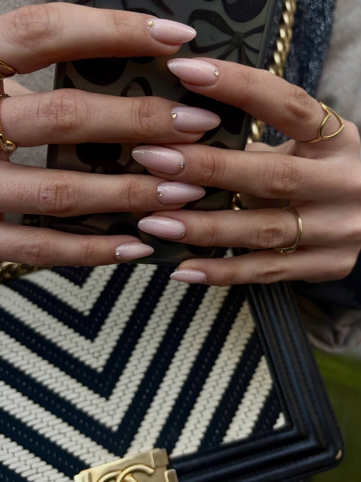 Subtle Shimmer Nude Almond Nails With Rhinestones