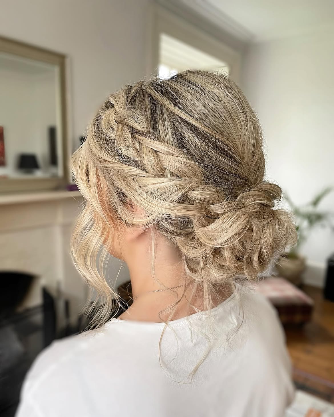 Textured Dutch Braids Into Romantic Messy Bun