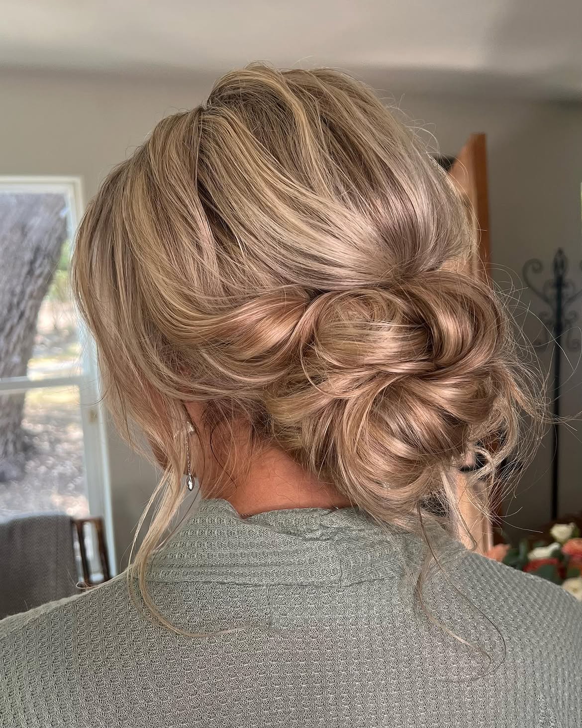 Textured Low Messy Bun With Face Framing Pieces