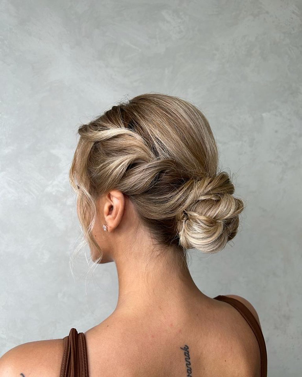 Twisted Braided Updo With Face-Framing Tendrils