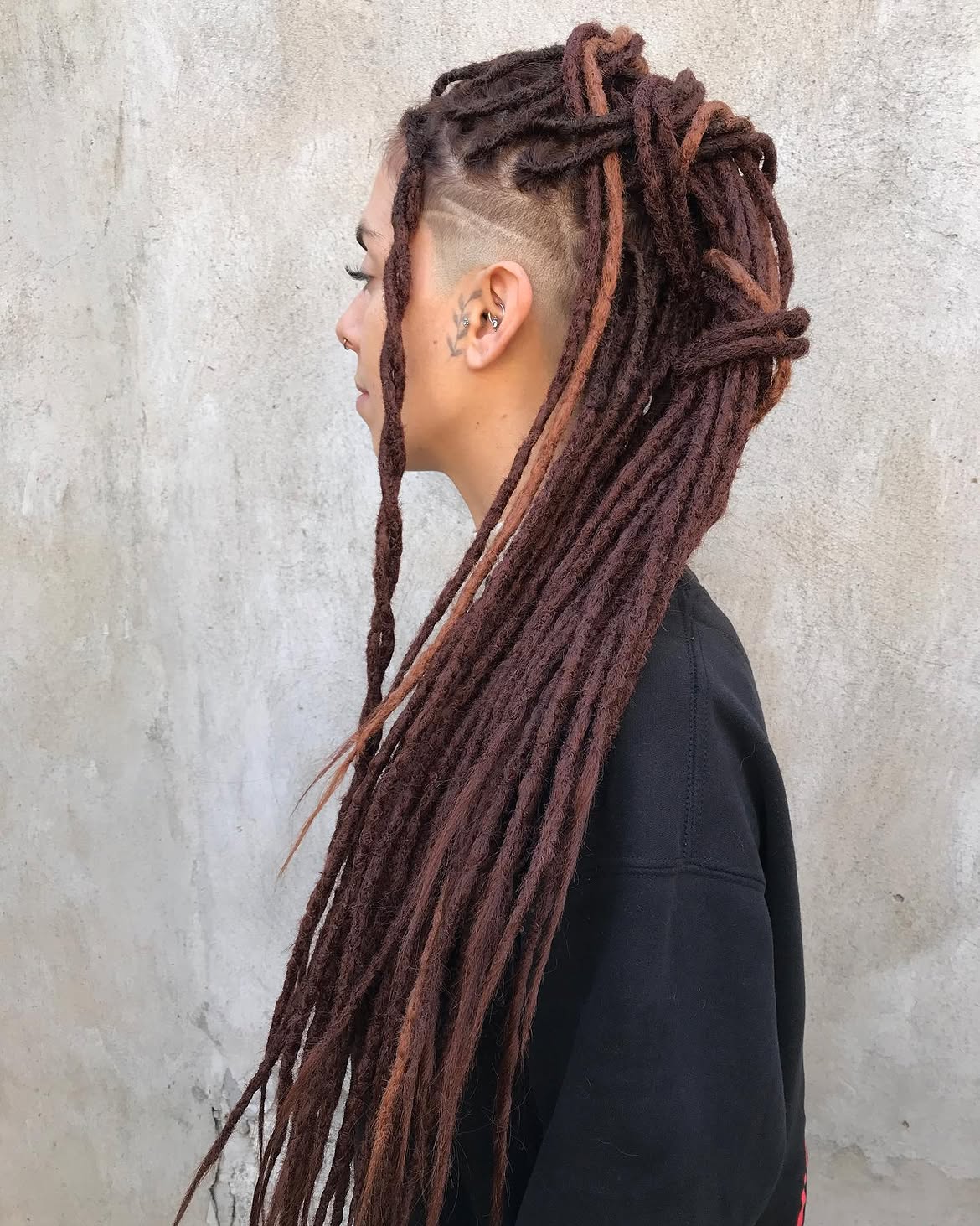 Undercut Dreads With Dimensional Auburn Highlights