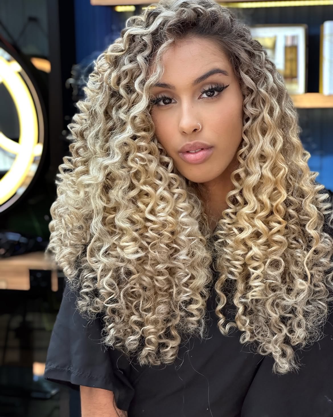 Voluminous Blonde Curly Layers With Defined Ringlets