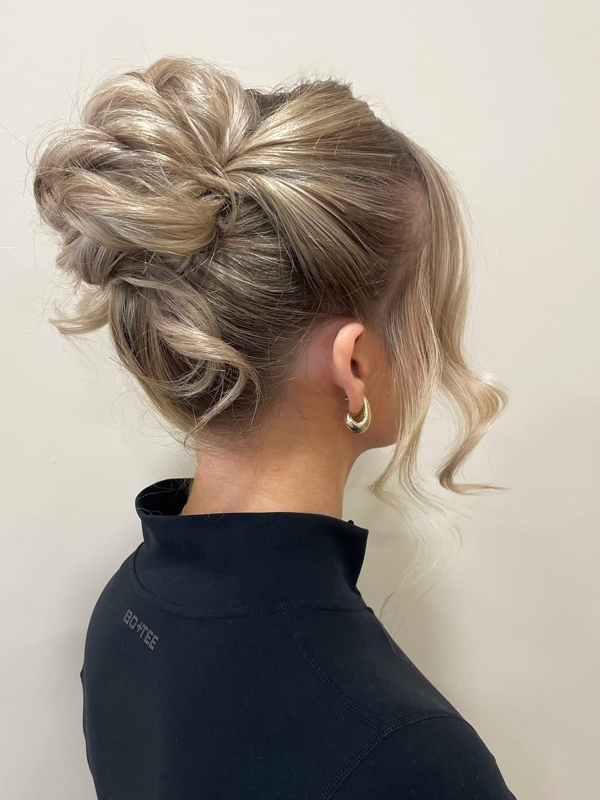 Voluminous Braided Updo With Face-Framing Tendrils