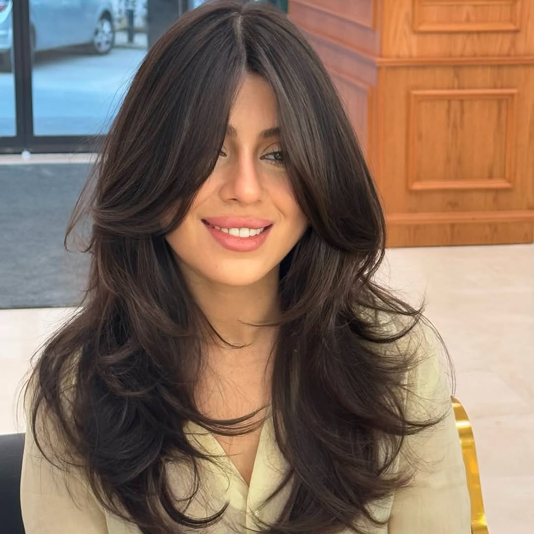 Voluminous Brunette Layers With Soft Curtain Bangs