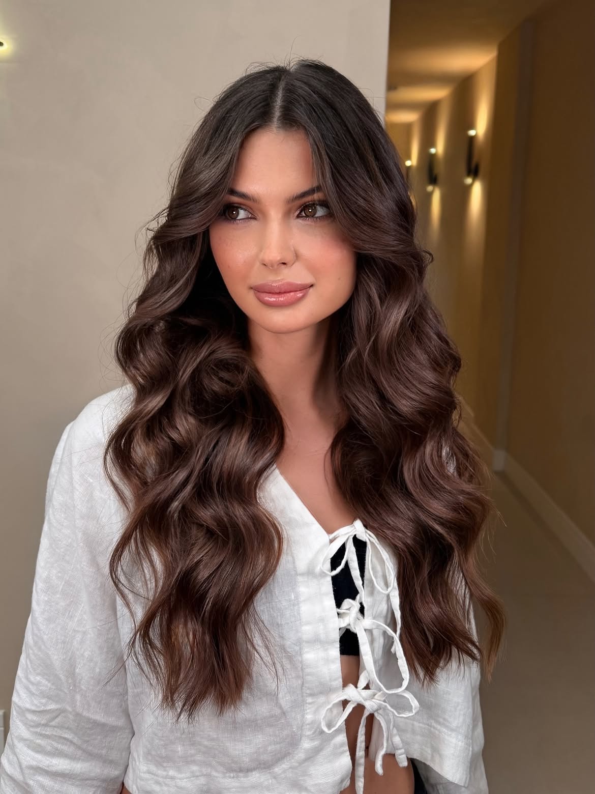 Voluminous Brunette Waves With Soft Face Framing