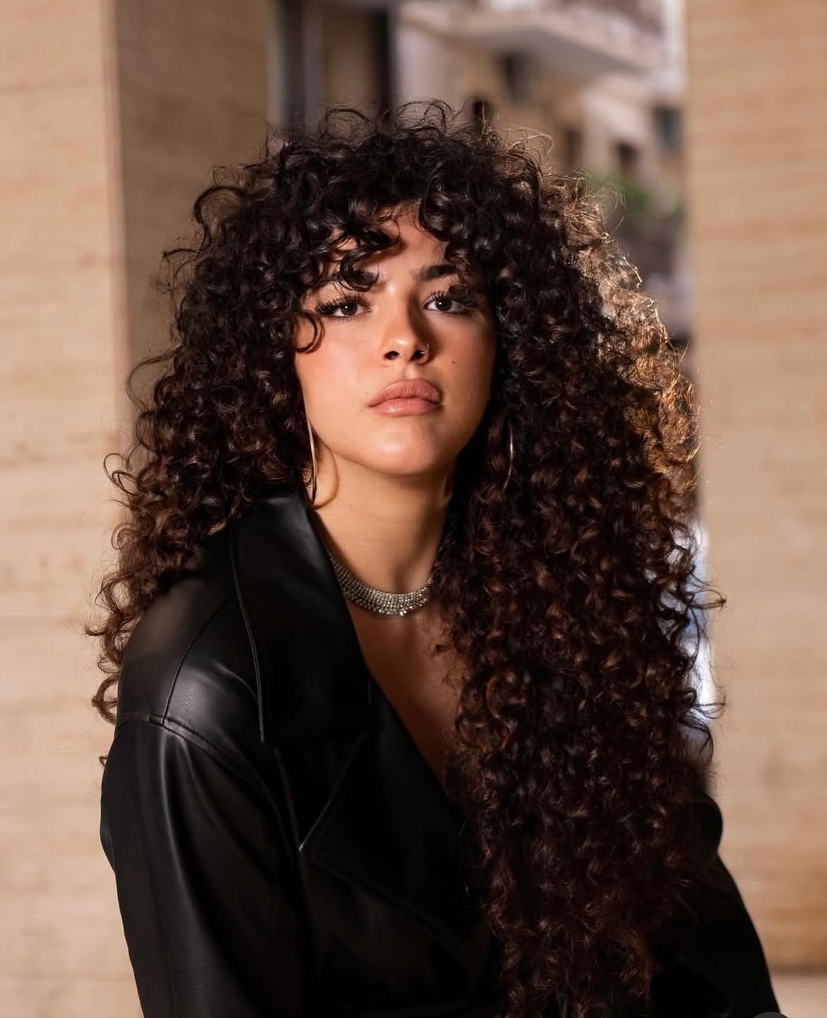 Voluminous Curly Shag With Defined Spiral Bangs
