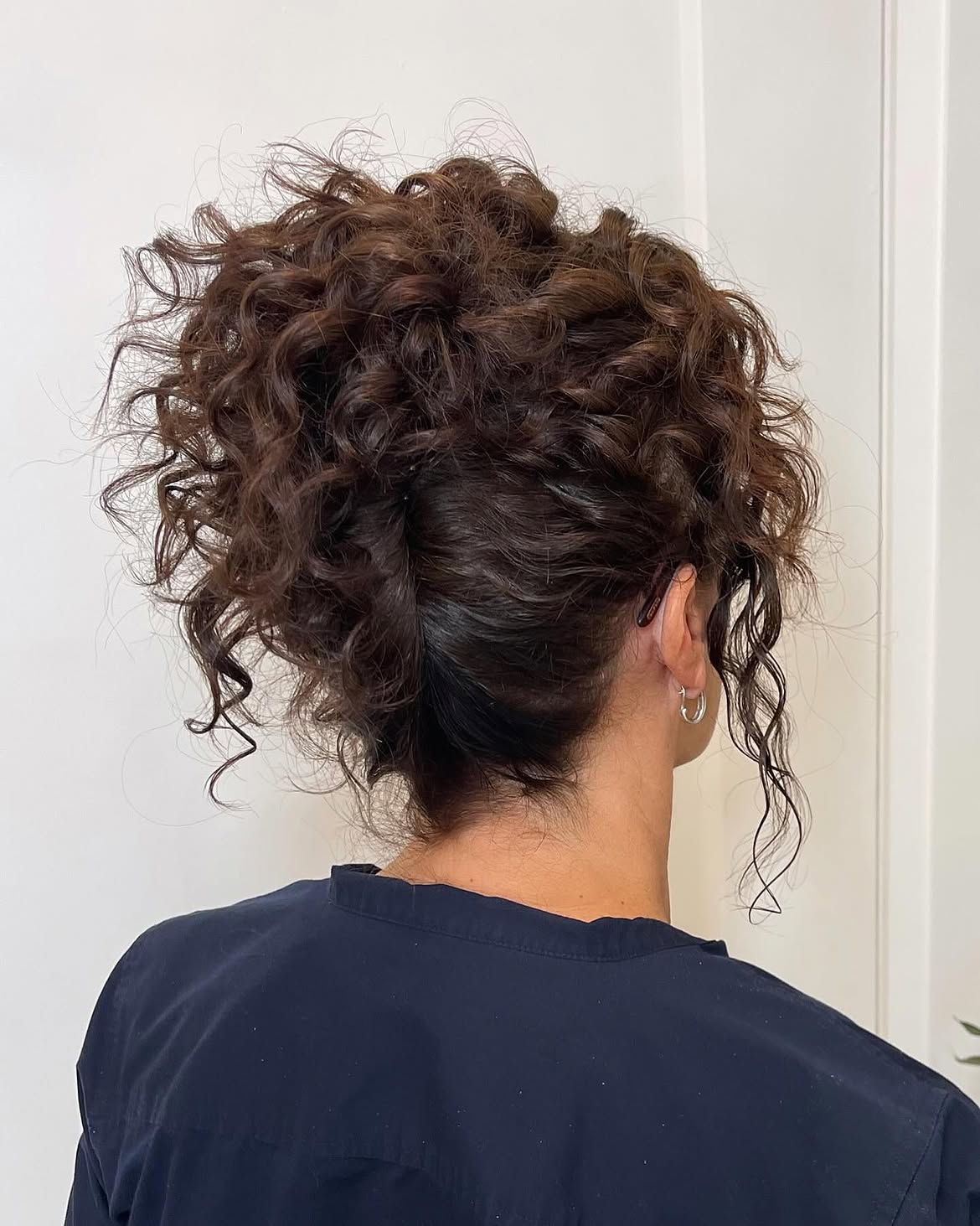 Voluminous Curly Updo With Face-Framing tendrils