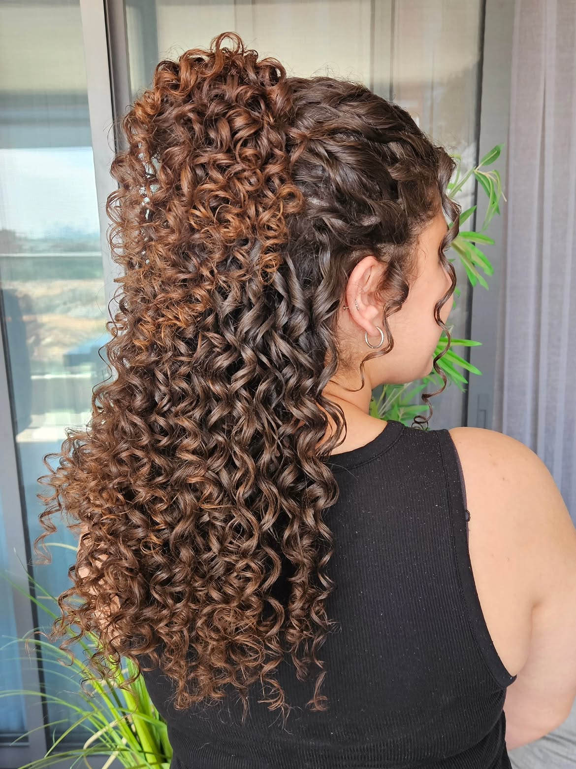 Voluminous High Ponytail With Defined Curls