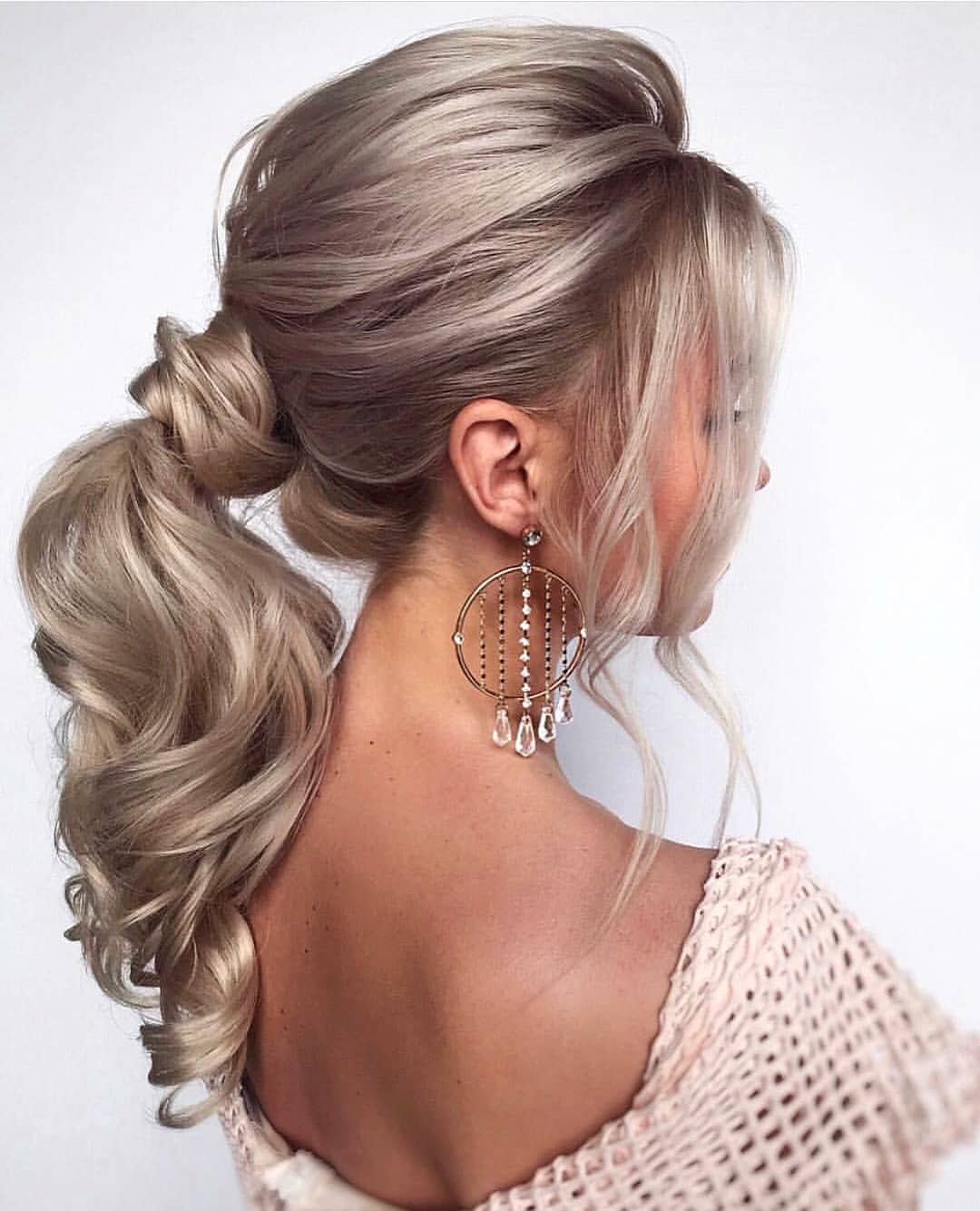 Voluminous High Ponytail With Loose Waves
