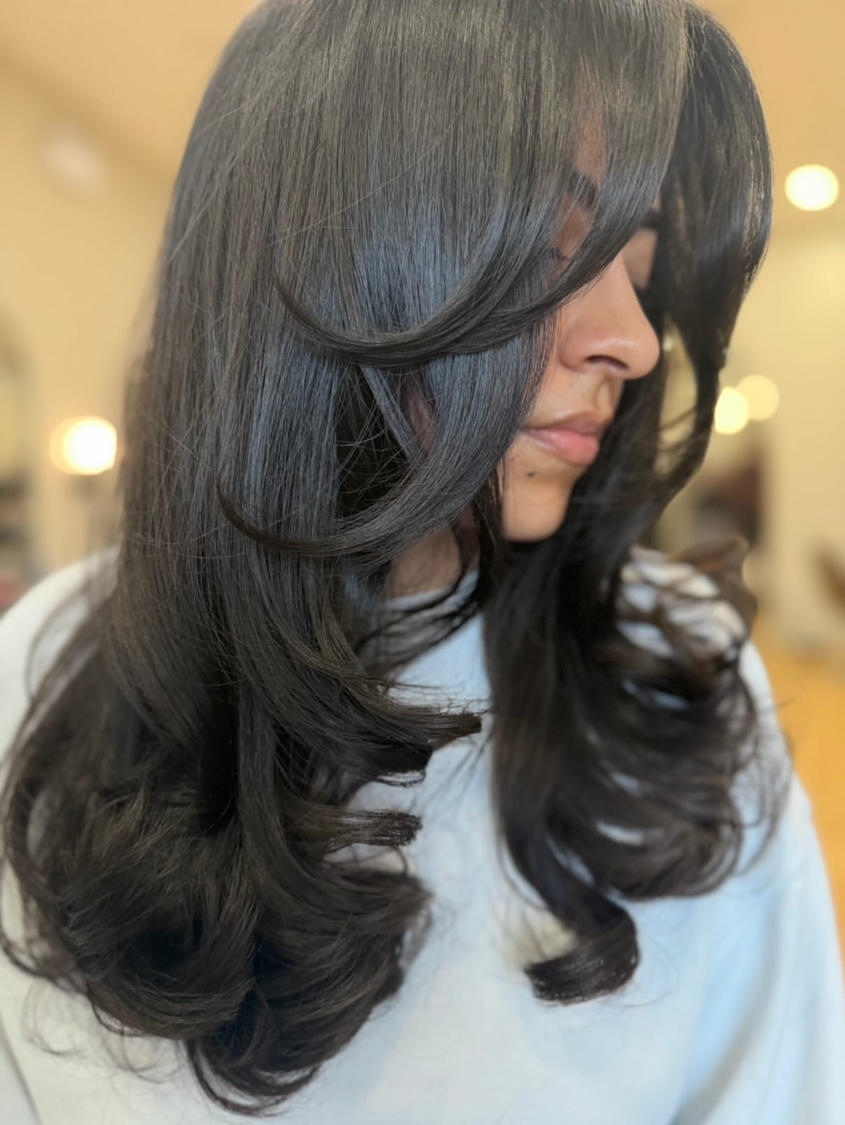 Voluminous Layered Cut With Soft Face Framing Bangs