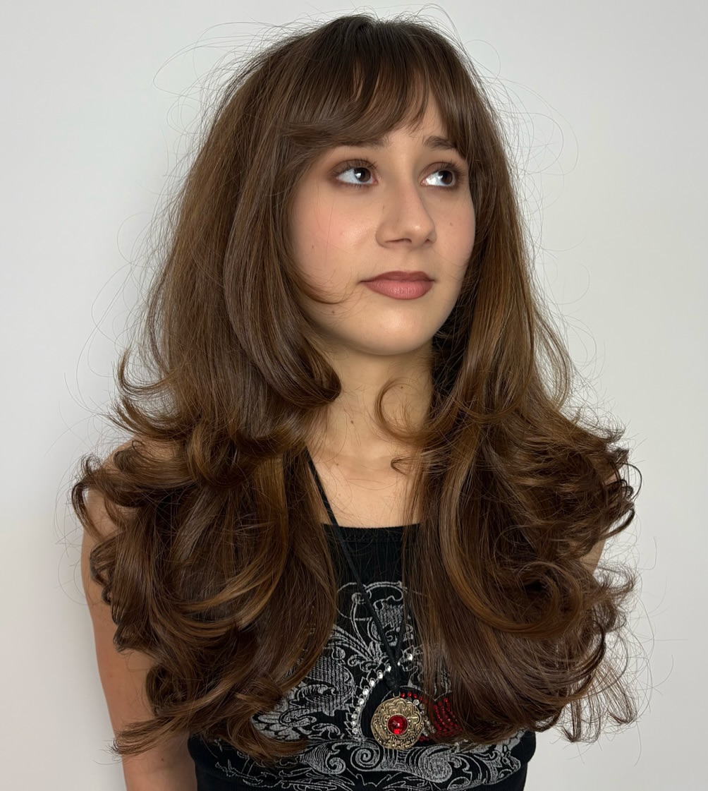 Voluminous Layered Cut With Soft Wispy Bangs