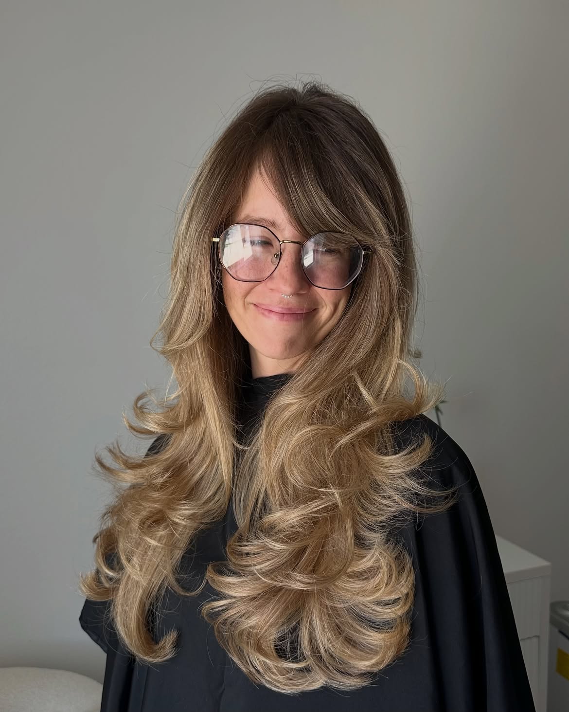 Voluminous Layers With Soft Side Swept Bangs