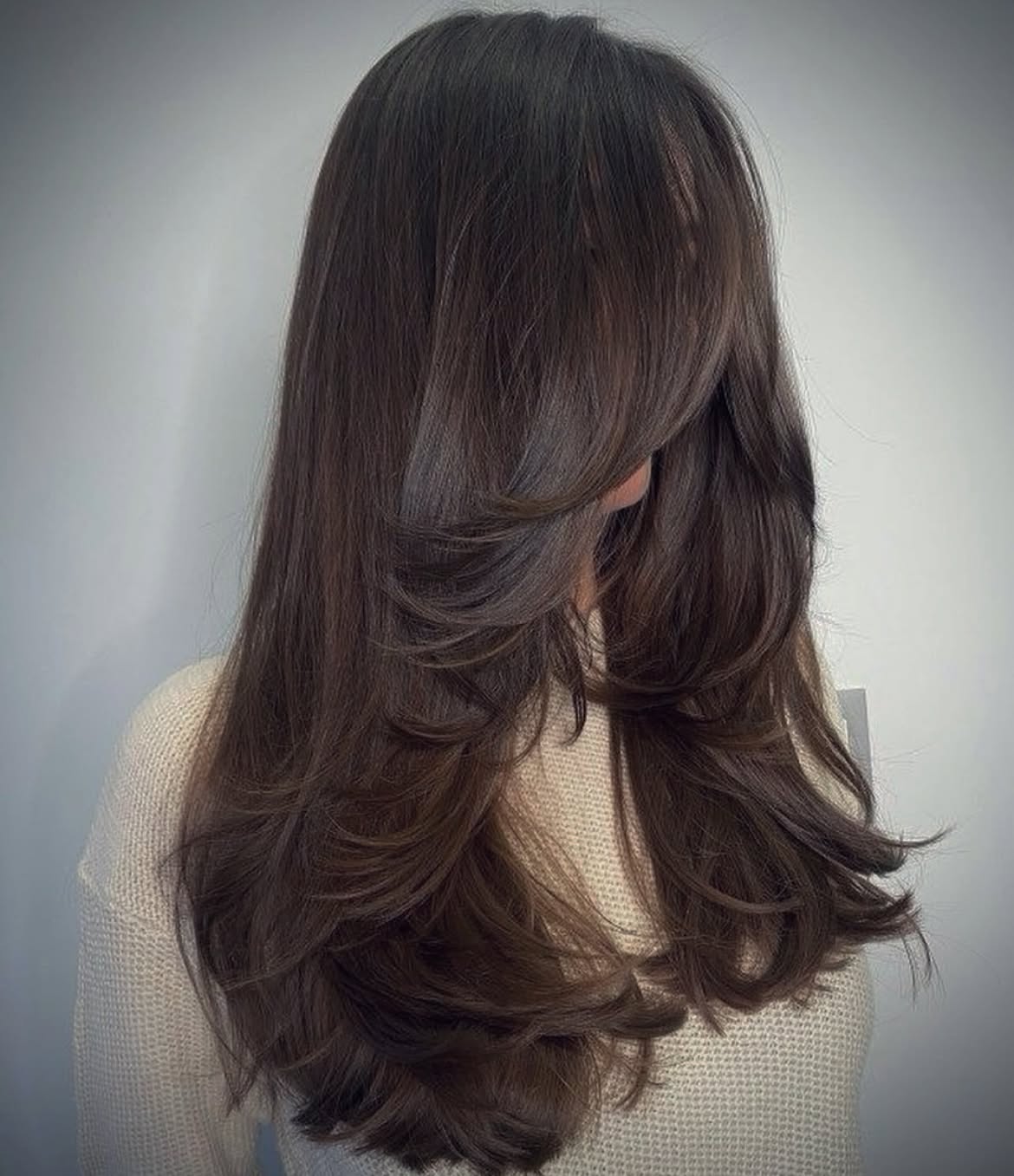 Voluminous Long Layers With Soft Curtain Bangs