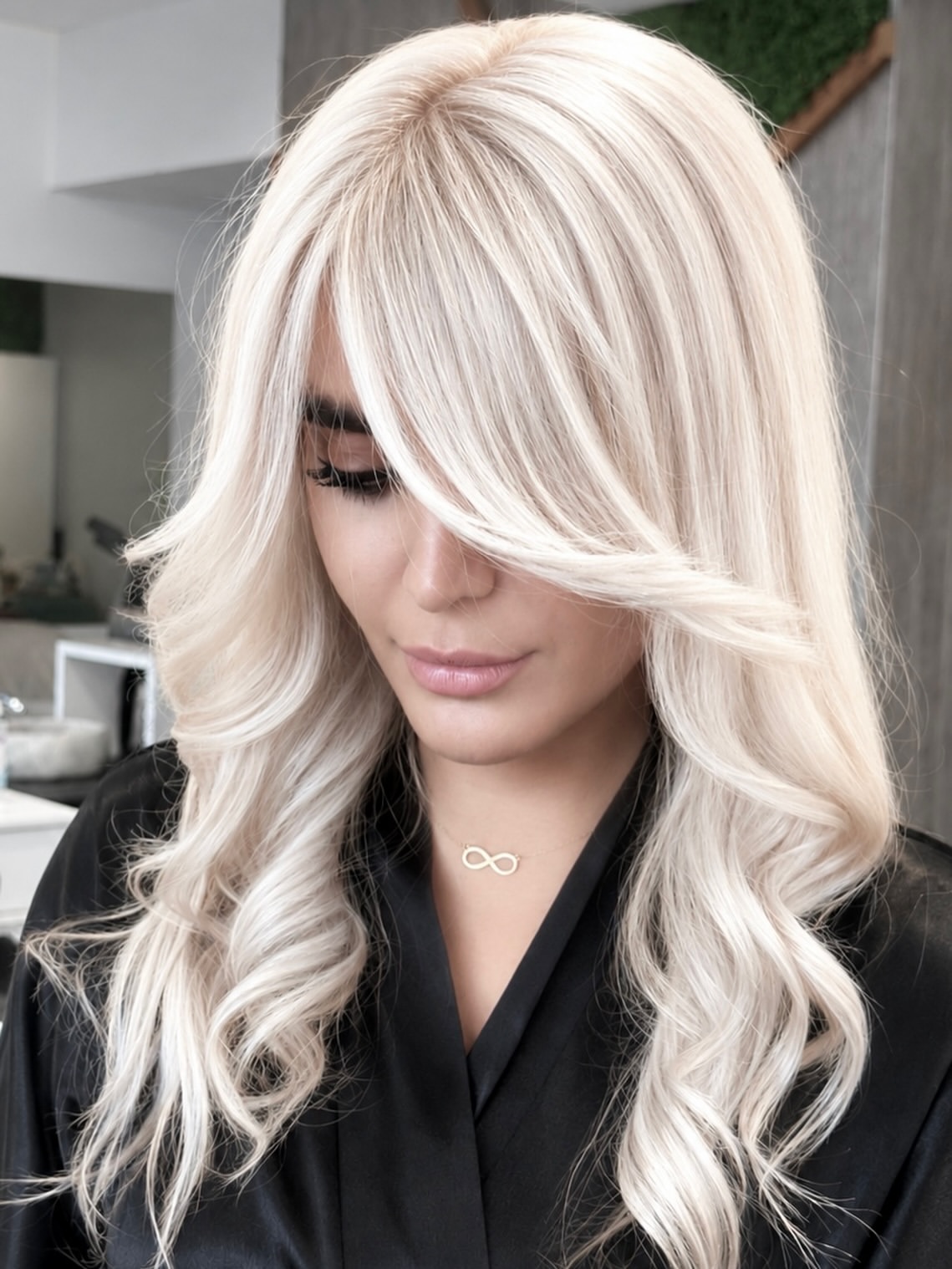 Voluminous Side Swept Bangs On Platinum Blonde Layers
