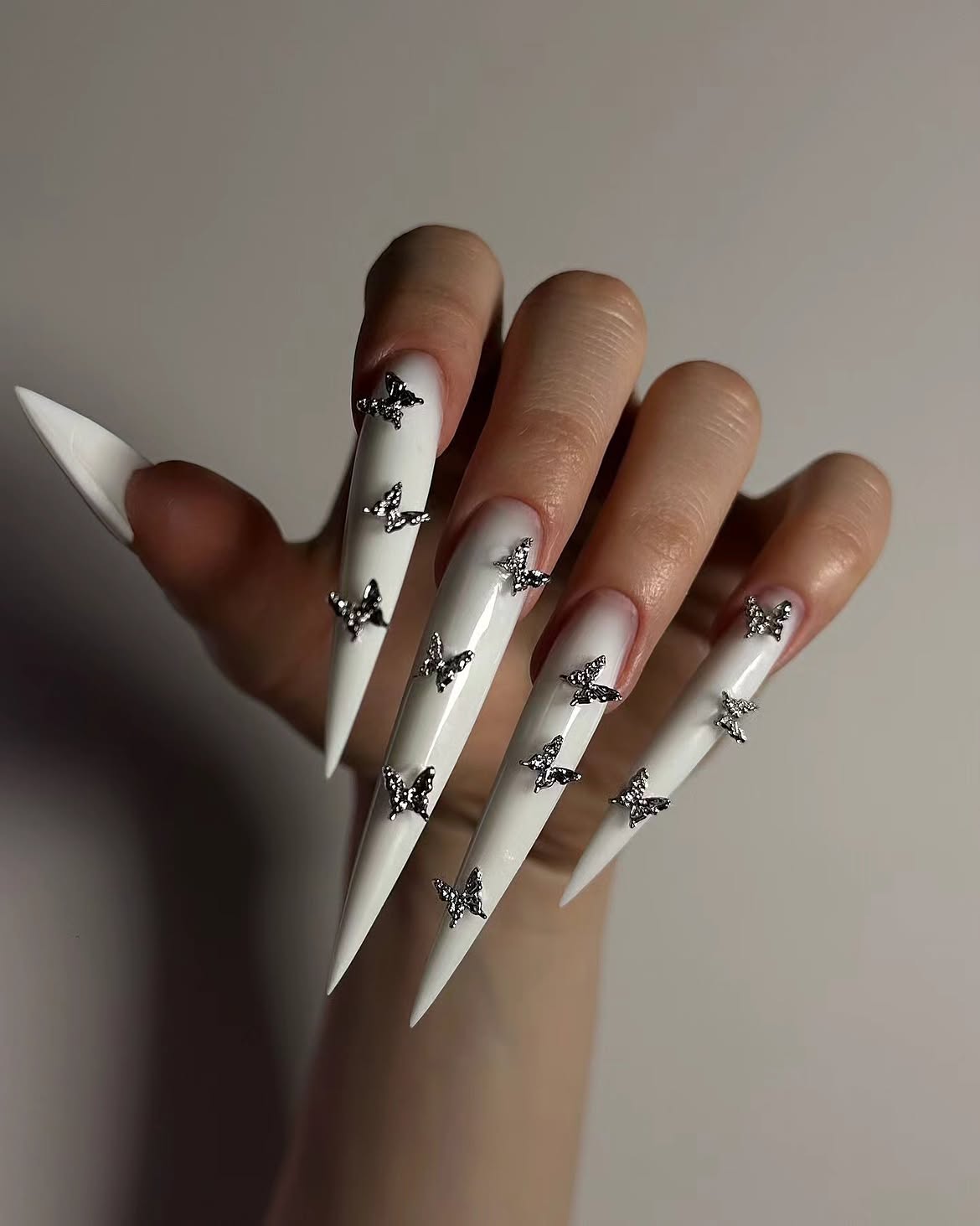 White Stiletto Nails with 3D Rhinestone Butterflies