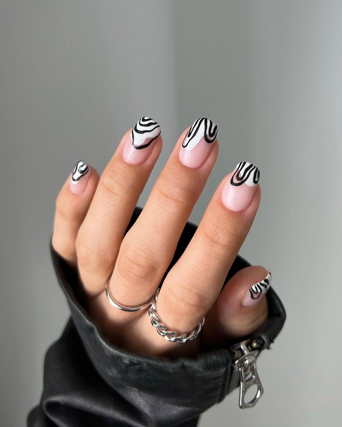 Abstract Swirl French Tip Almond Nails