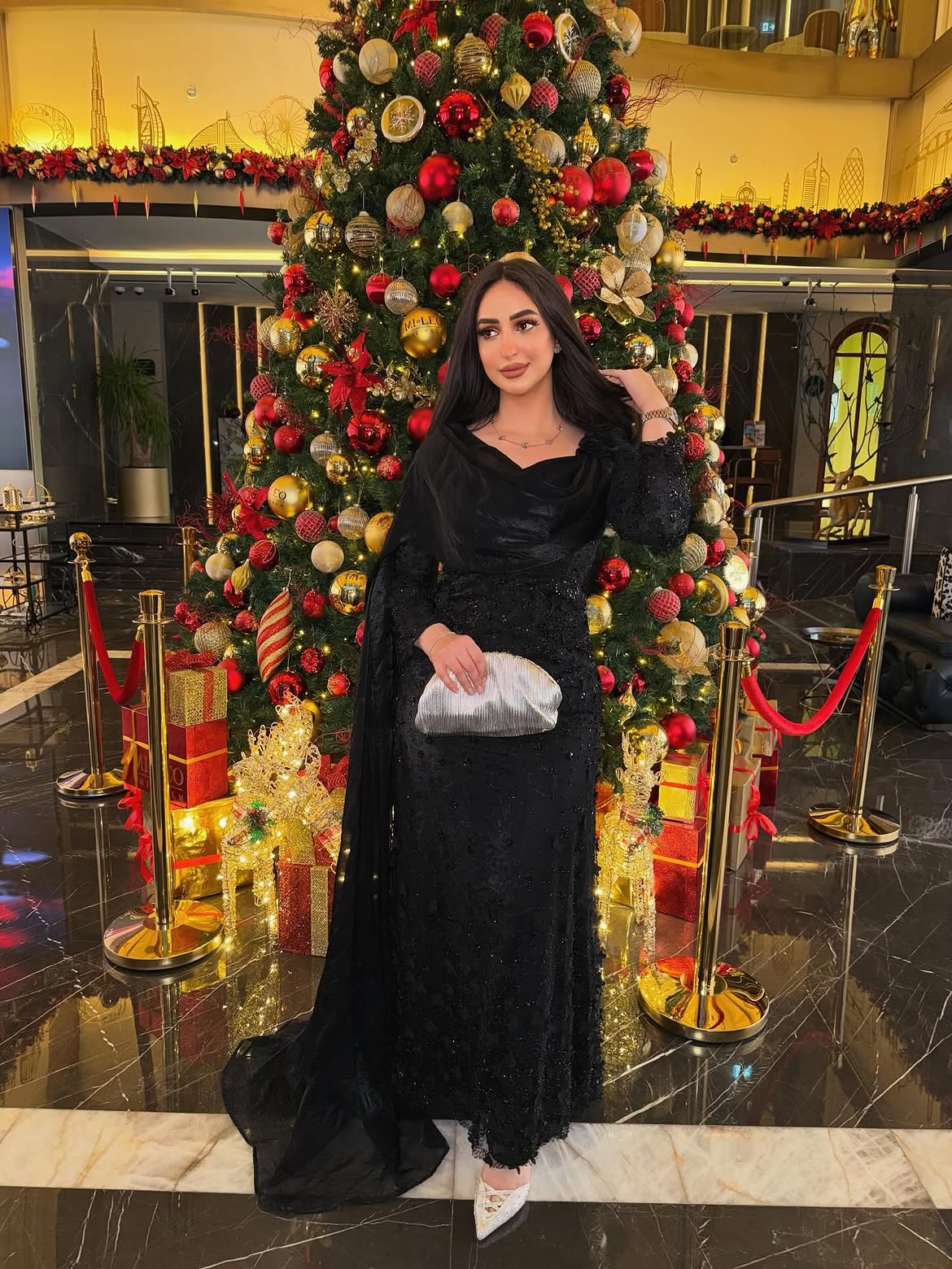 Black Beaded Long Sleeve Evening Gown With Silver Clutch