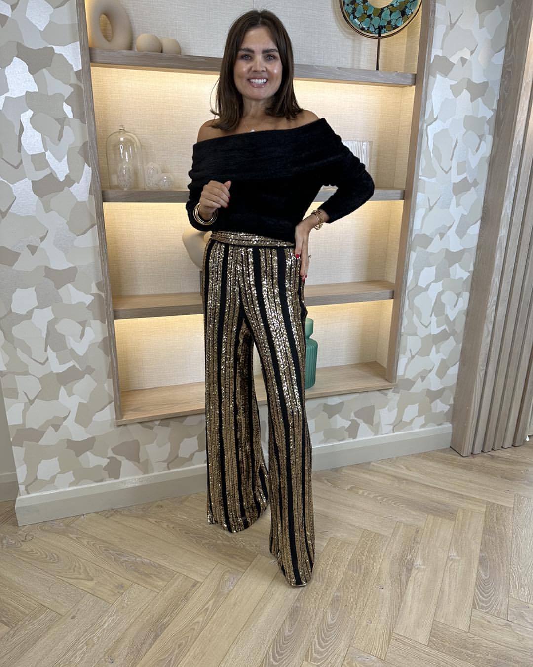 Black Off-Shoulder Top With Striped Sequin Pants