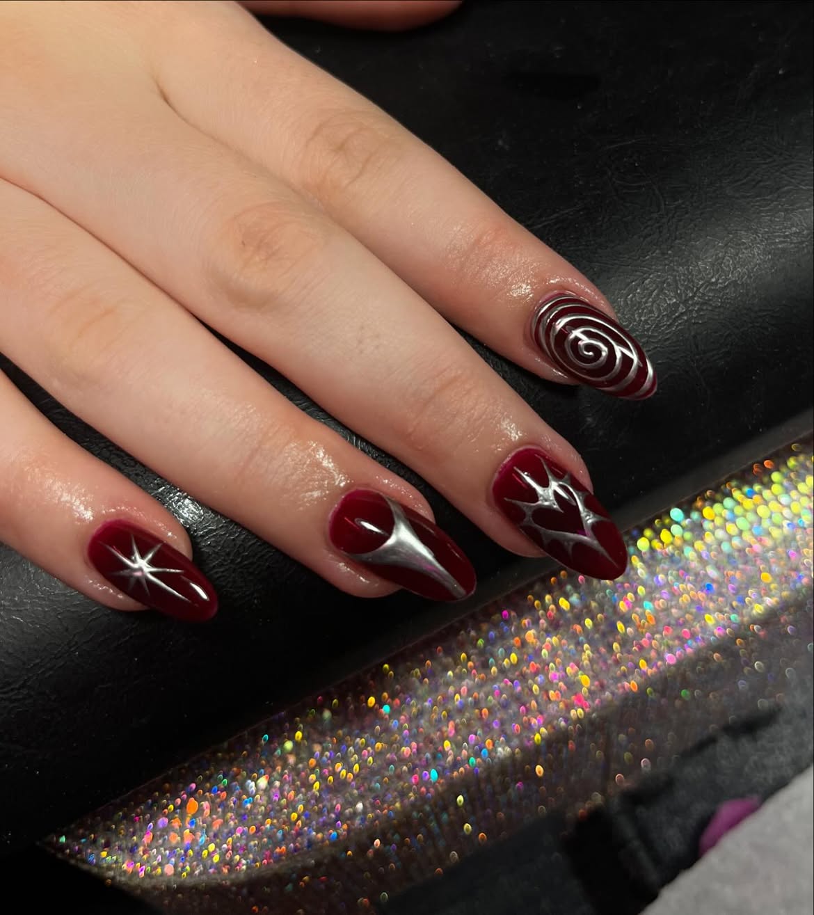 Burgundy Chrome Swirls and Starbursts Almond Nails