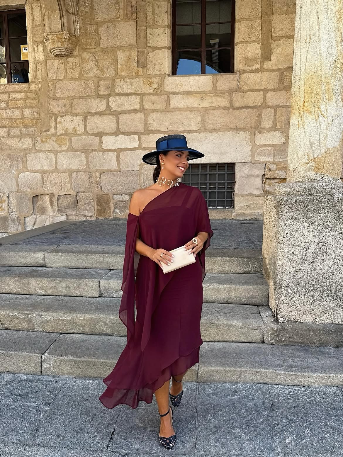 Burgundy One-Shoulder Cape Dress With Statement Hat