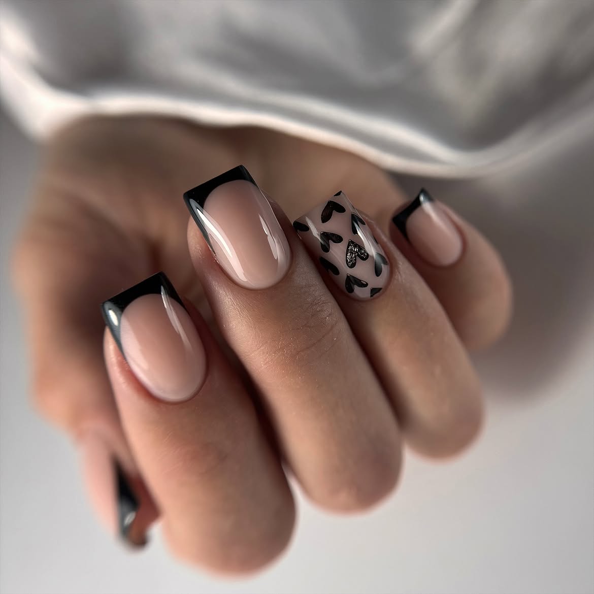Chic Black French Tips with Heart Accent Nail