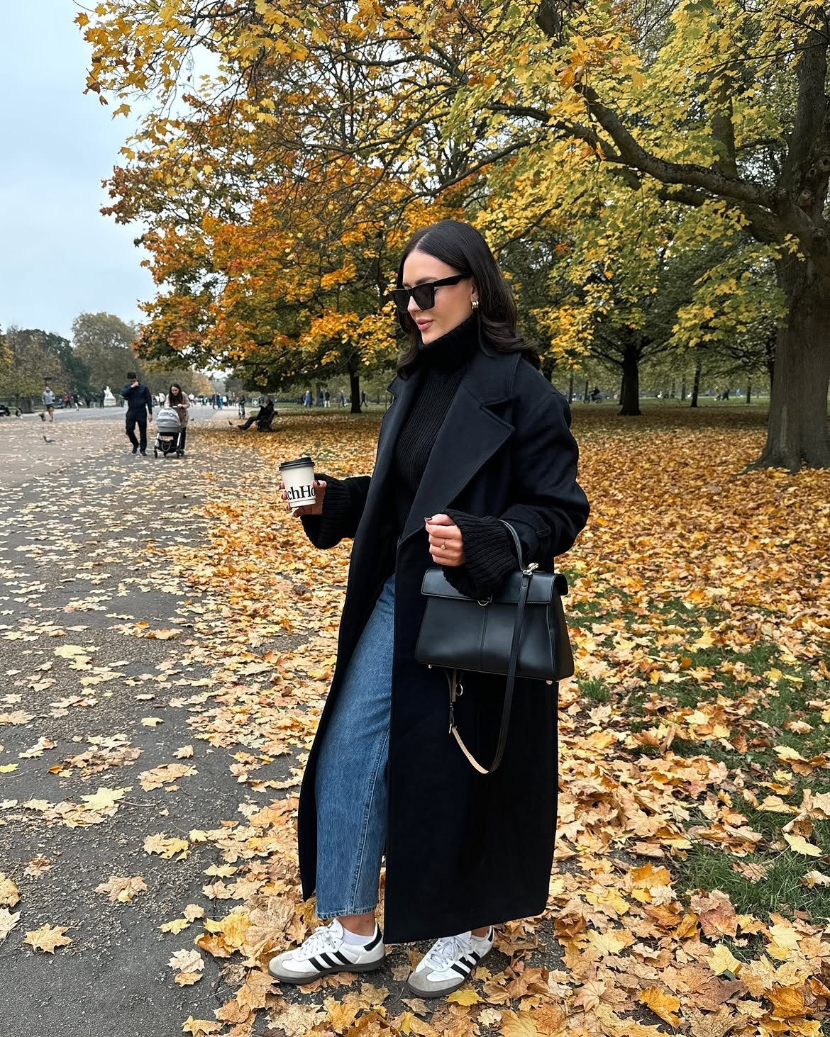 Chic Black Wool Coat With Classic Blue Jeans