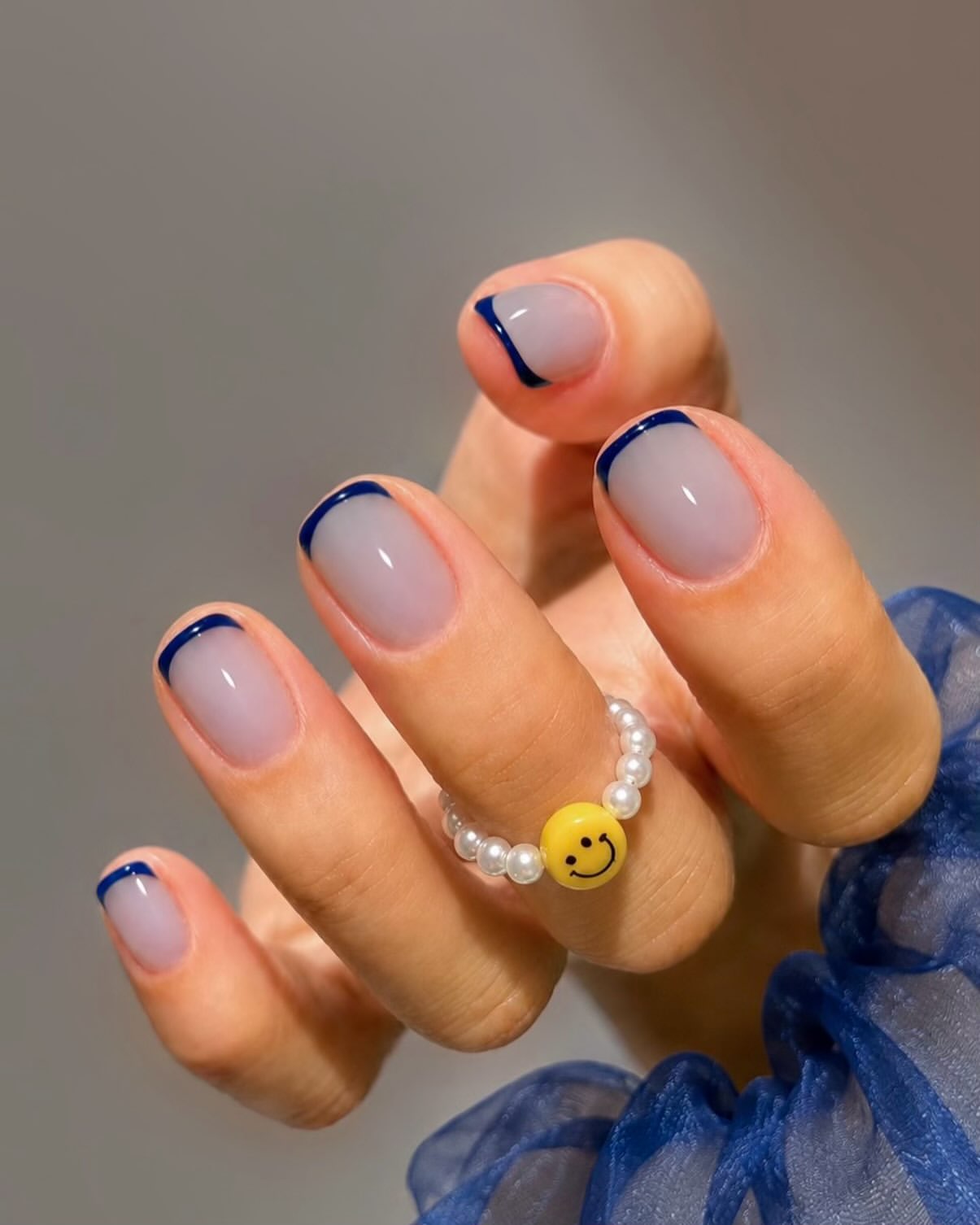 Classic French Tips With a Deep Navy Twist