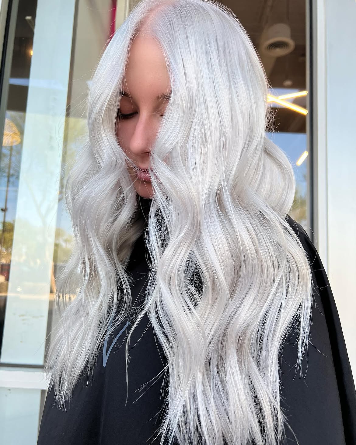 Cool Platinum Blonde Waves With Long Face Framing Layers