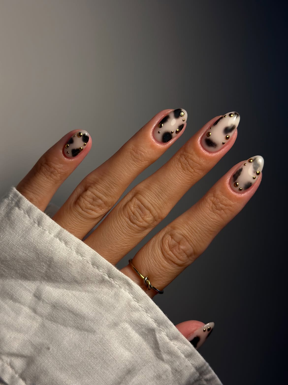 Cow Print Almond Nails with Gold Studs