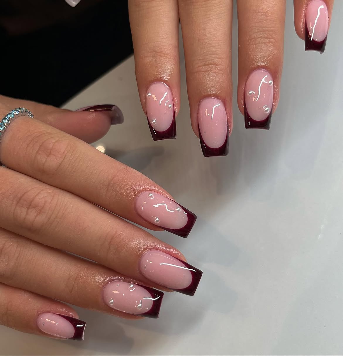 Deep Burgundy French Tips with Pearl Accents