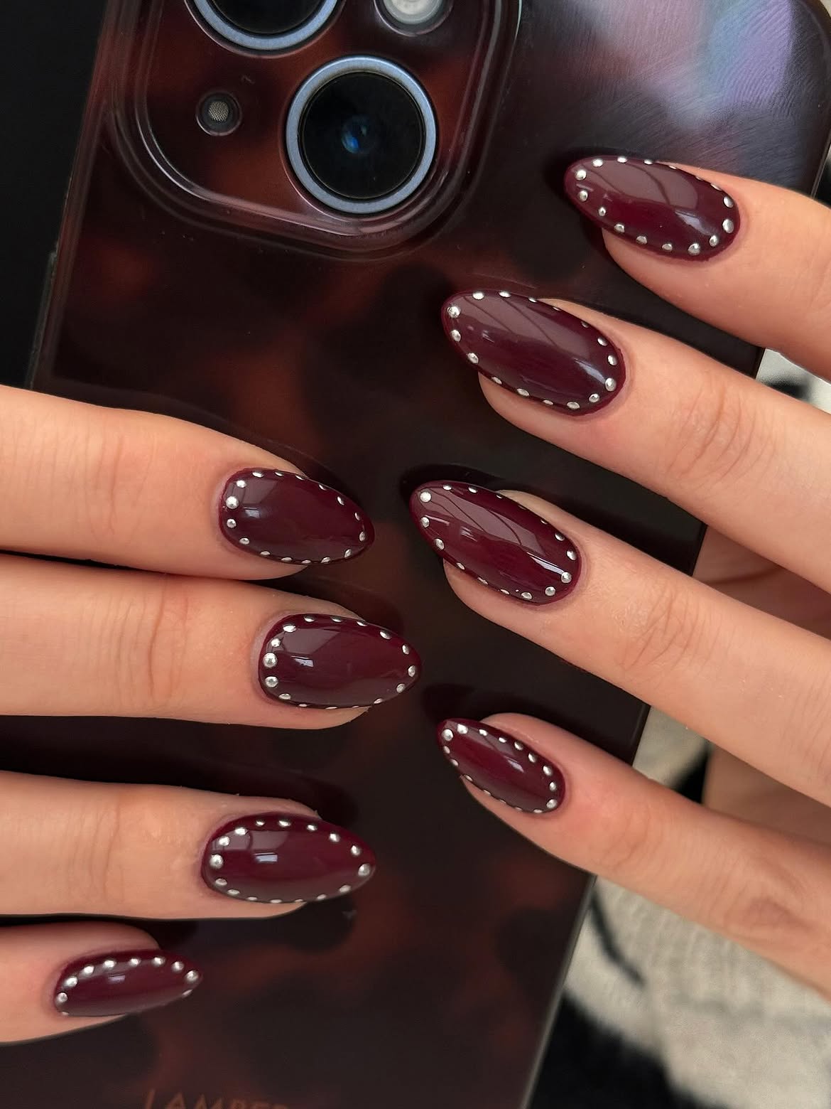 Deep Burgundy Oval Nails with Silver Stud Border