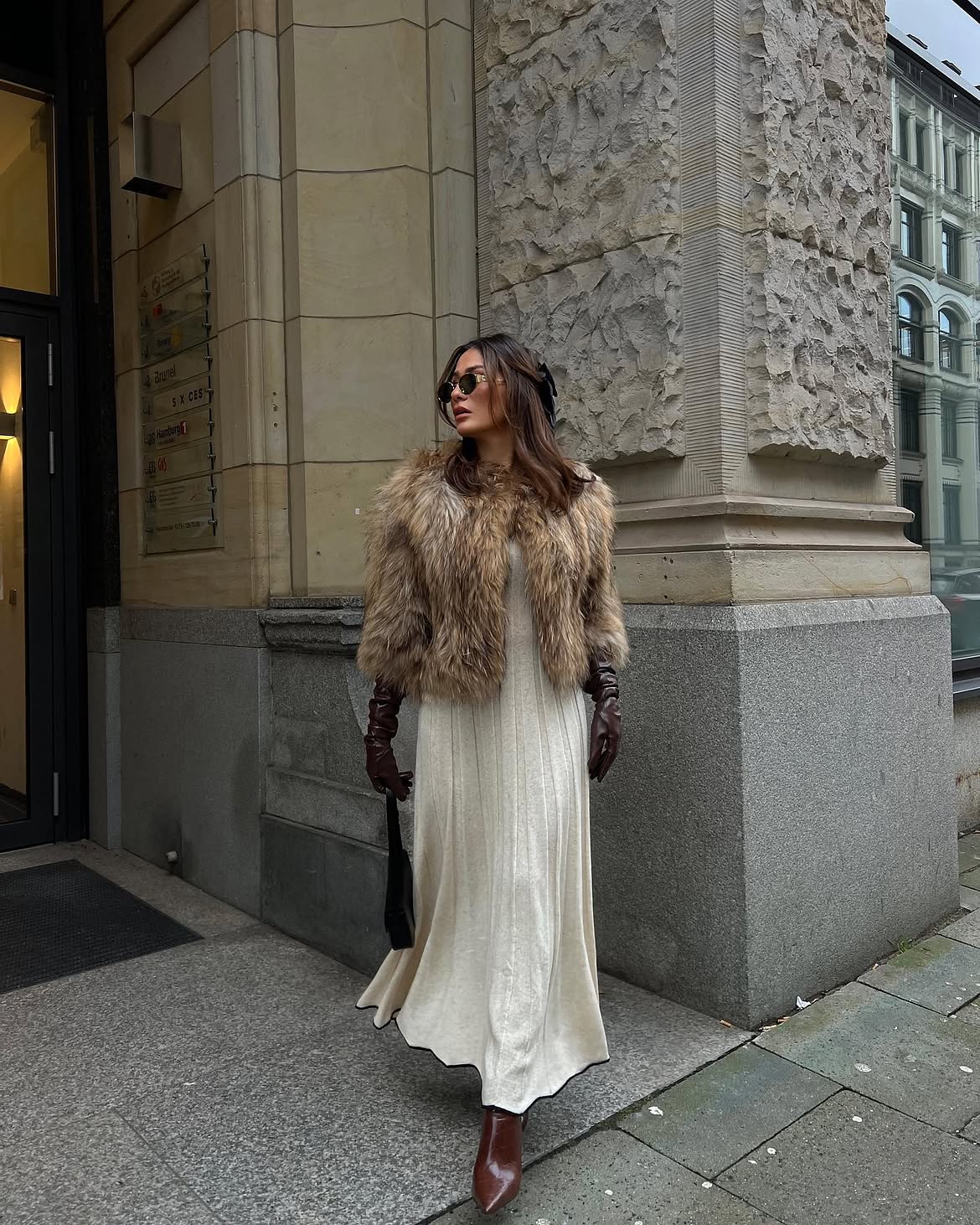 Elegant Fur Coat Over Cream Knit Maxi Dress