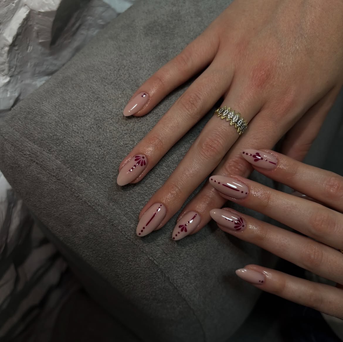 Elegant Nude Almond Nails with Burgundy Accents