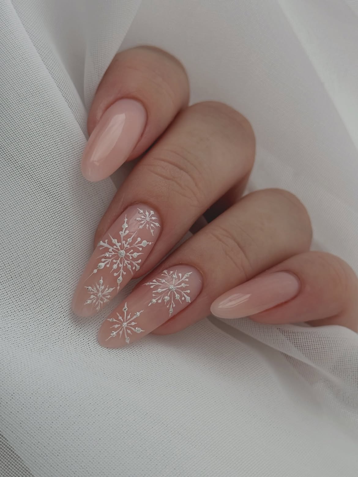 Elegant Snowy Snowflake Almond Nails