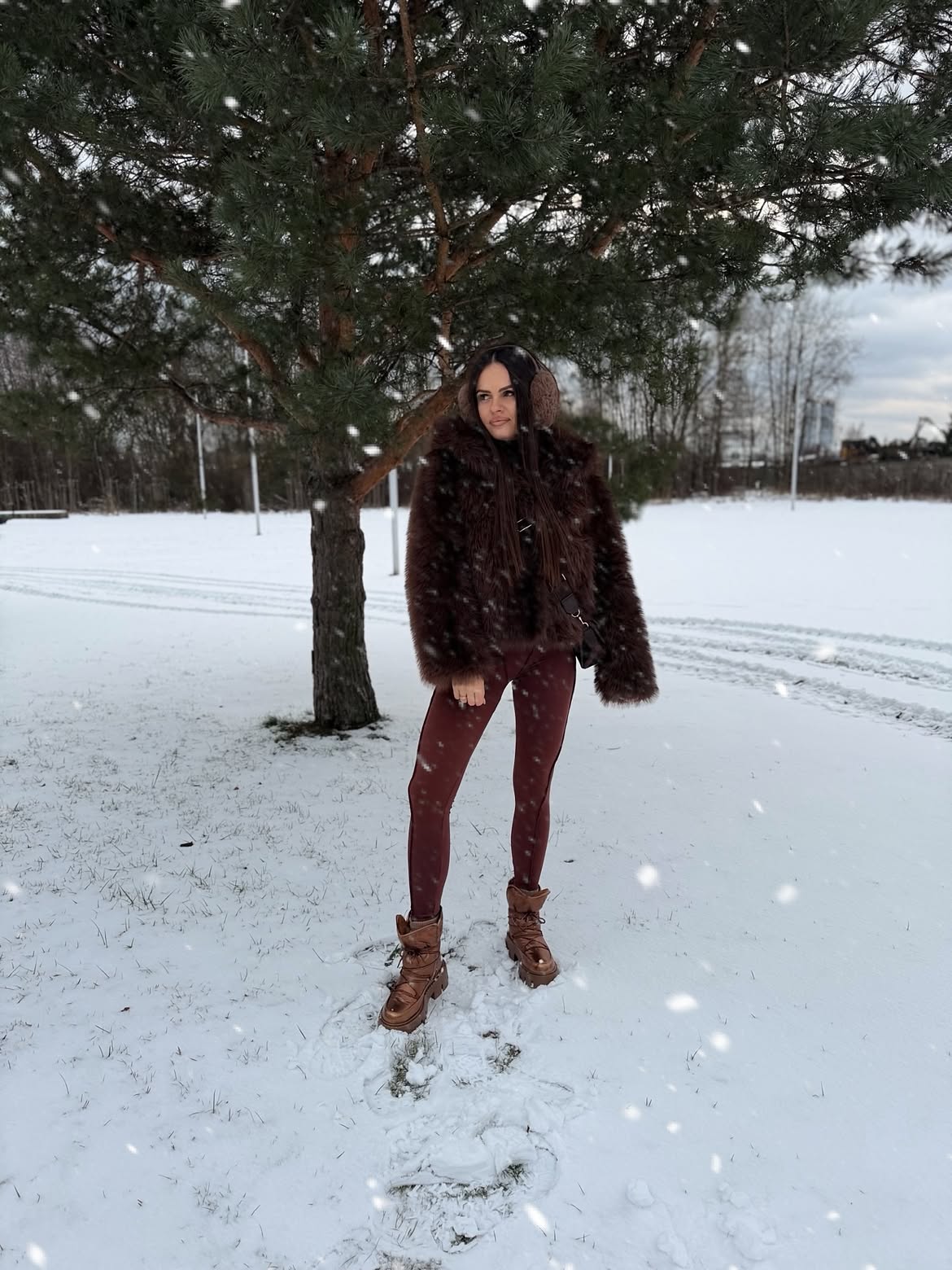 Faux Fur Jacket With Burgundy Leggings And Boots