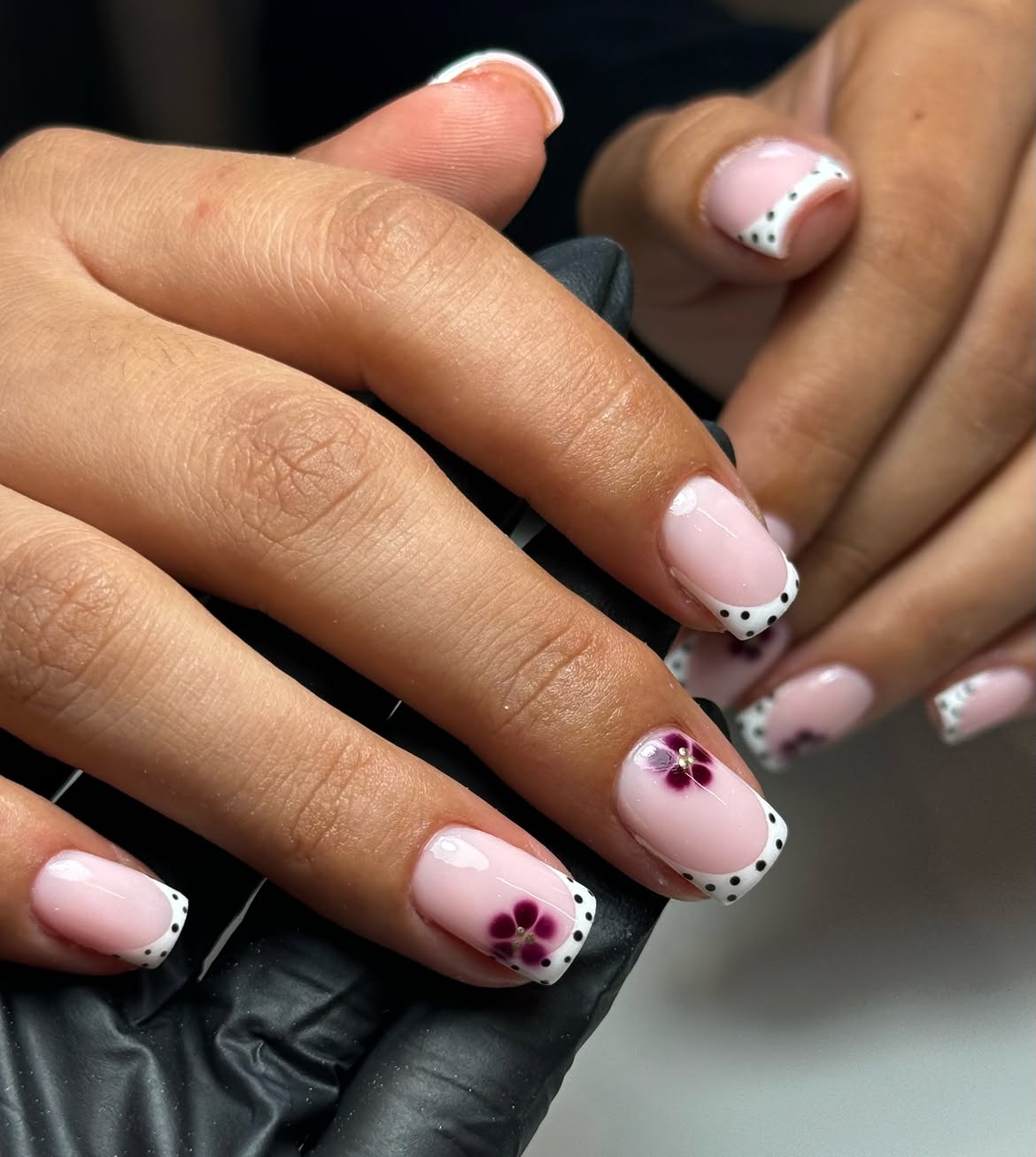 French Tip Nails with Polka Dots and Floral Accent