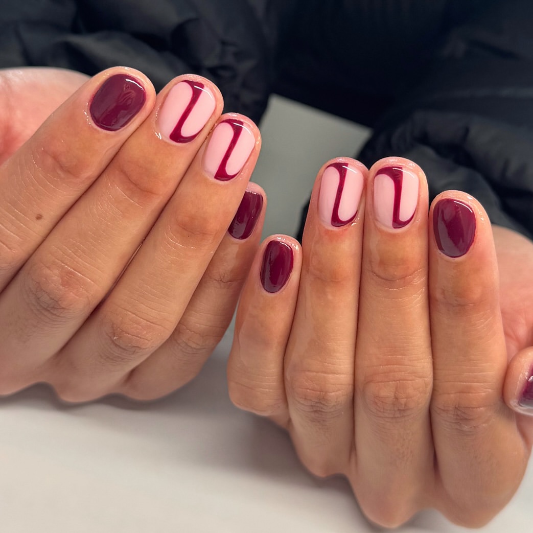 Glossy Burgundy And Pink Swirl Short Squoval Nails