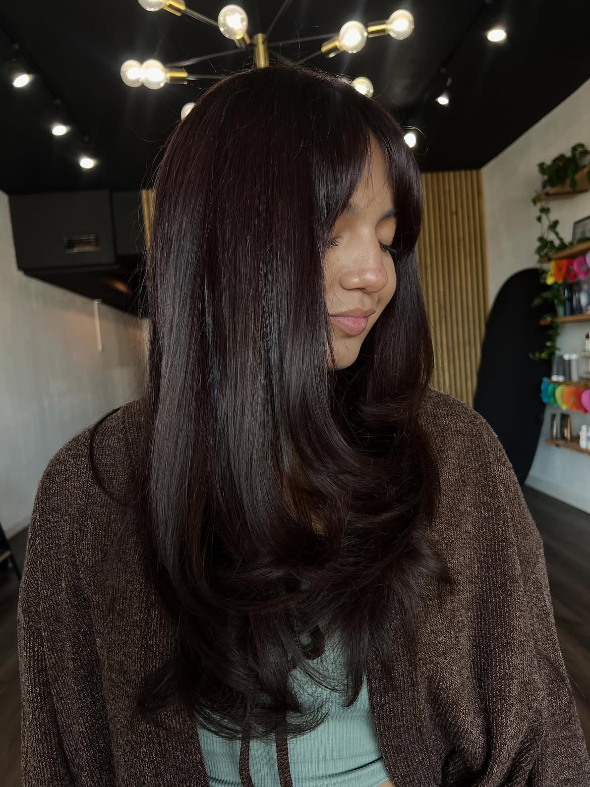 Glossy Layered Brunette Blowout With Curtain Bangs