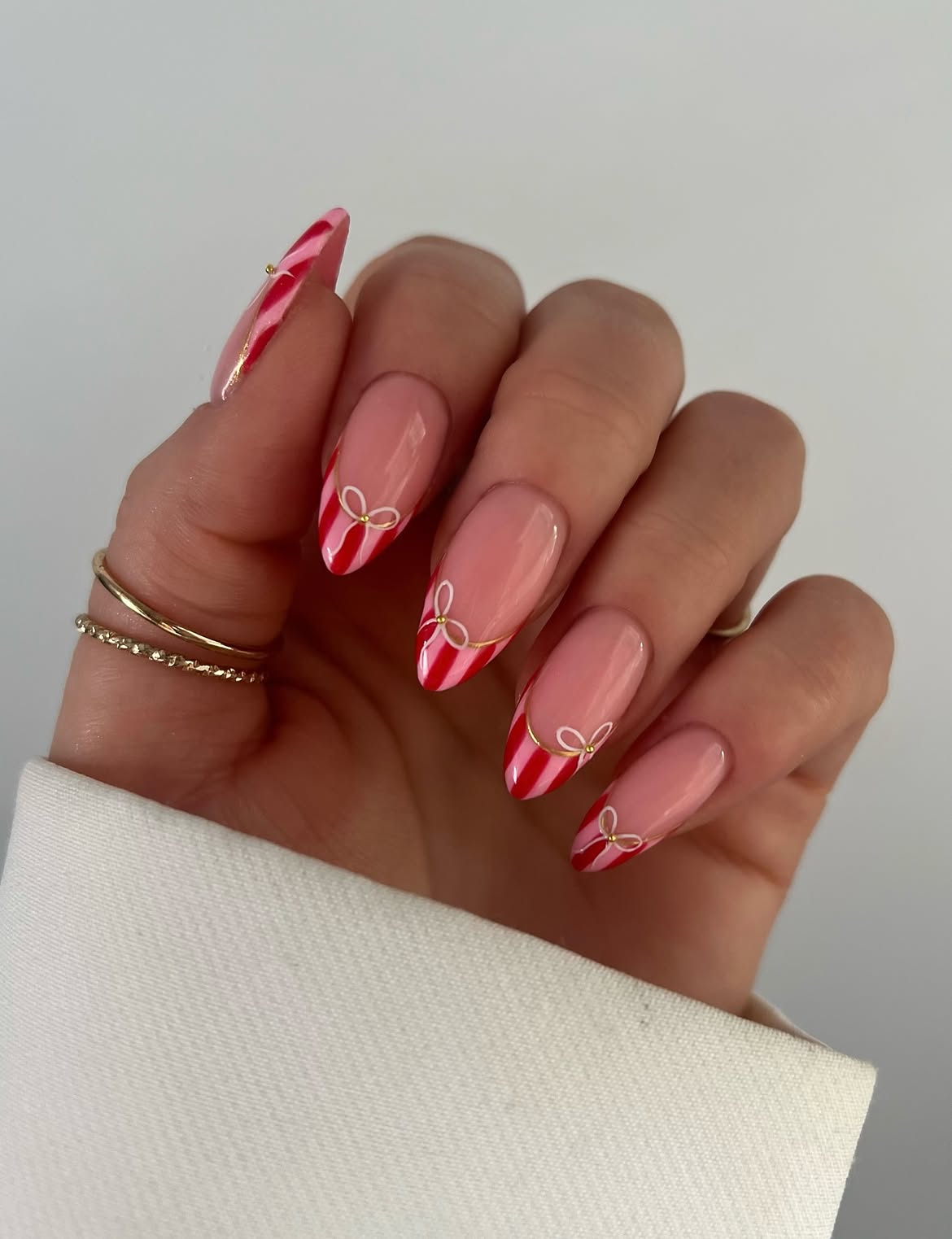 Glossy Red Candy Cane French Almond Nails