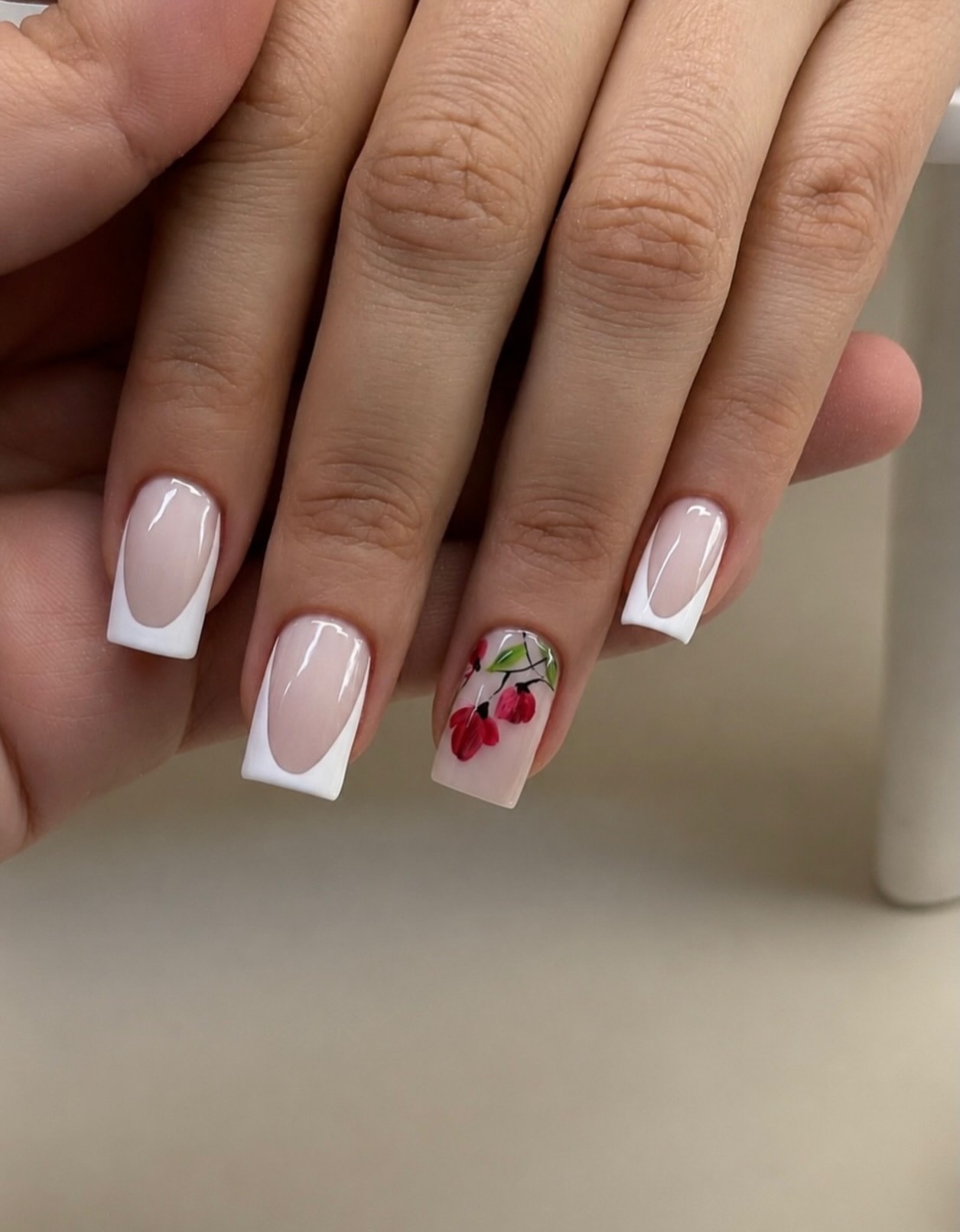 Glossy White French Tip Coffin Nails with Floral Accent