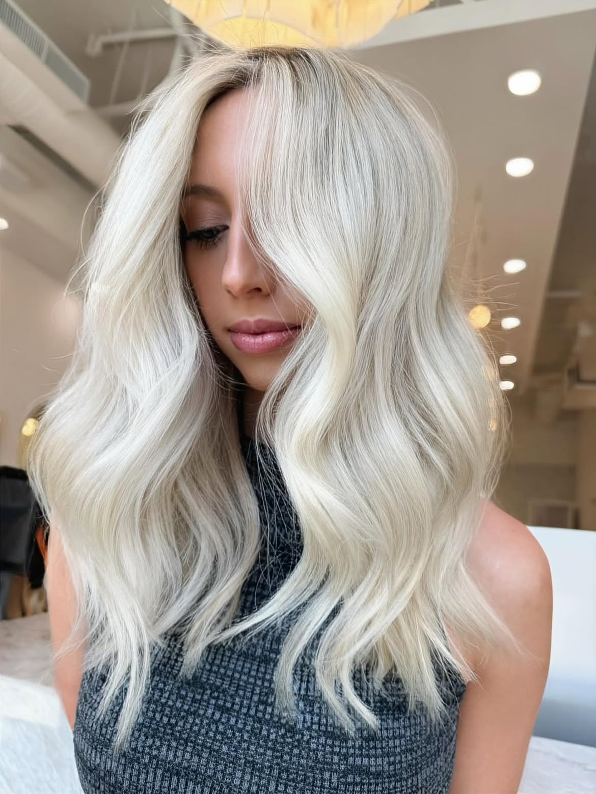 Icy Platinum Blonde Waves With Face Framing Layers
